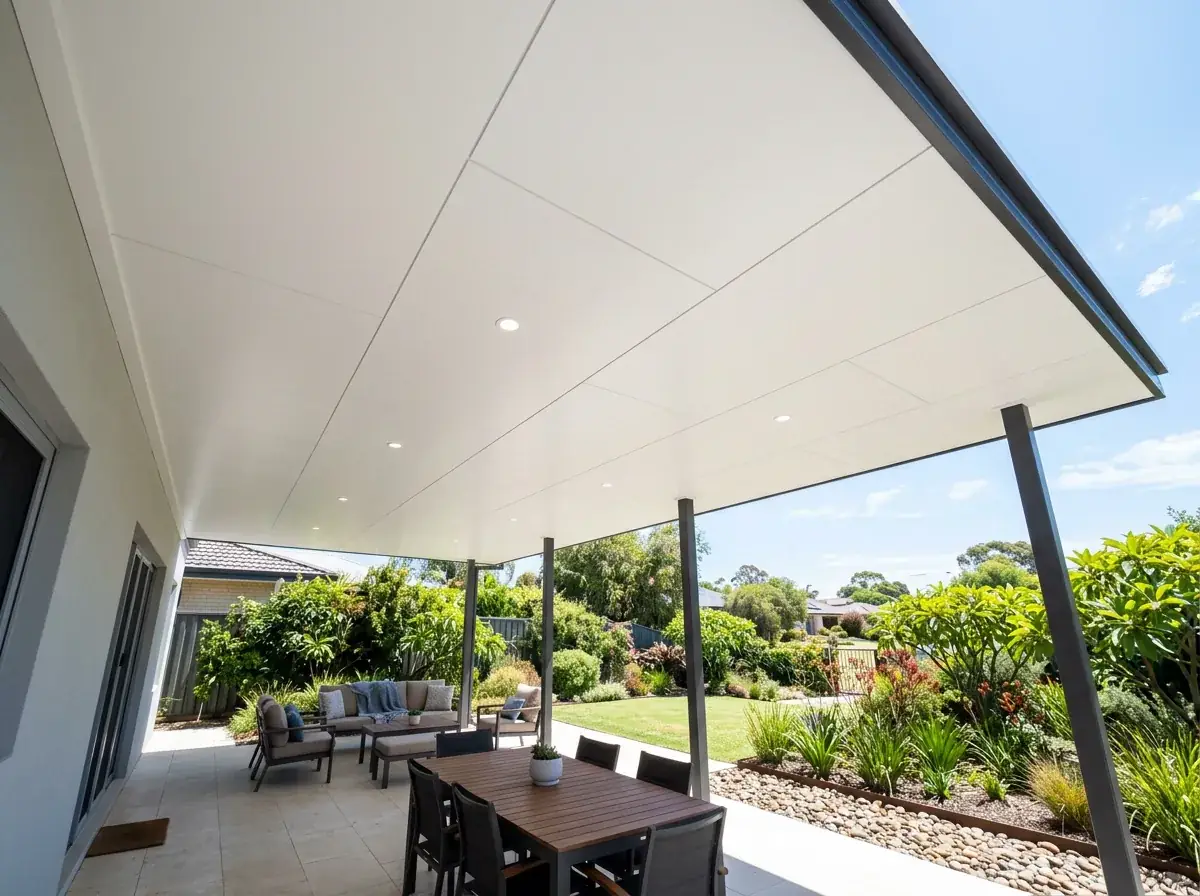 Insulated panel flat patio on a rendered Perth home, smooth pale ceiling with flush downlights and no purlins under the level roofline